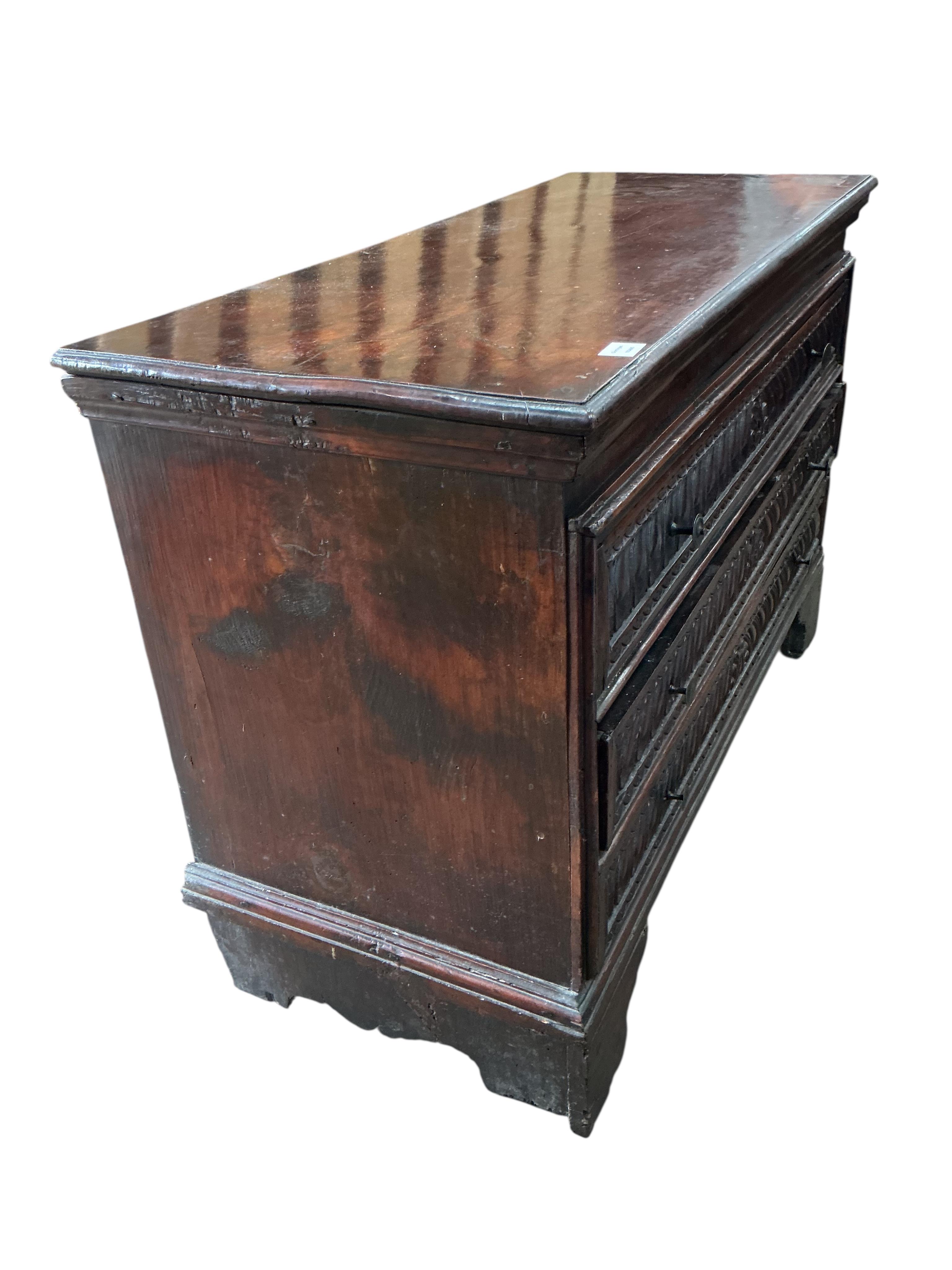 An 18th century Continental carved walnut chest, width 131cm, depth 56cm, height 88cm